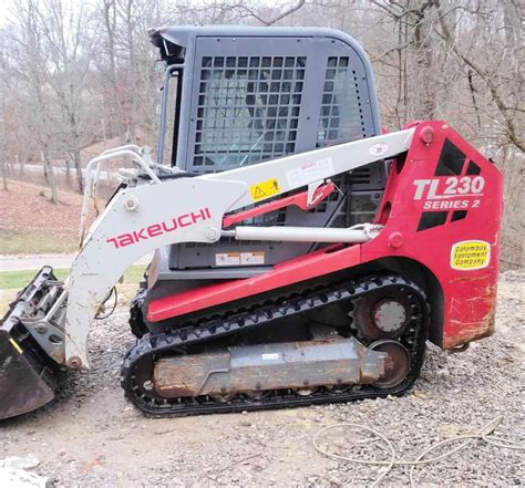 how to tilt cab on tl230 takeuchi skid steer|skid steer tl10 lift.